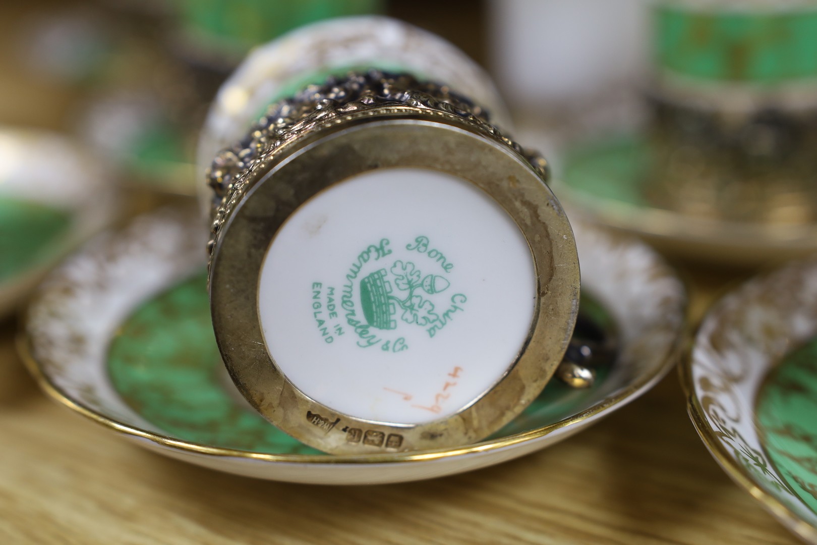 A Hammersley & Co porcelain coffee set with associated silver gilt cup holders